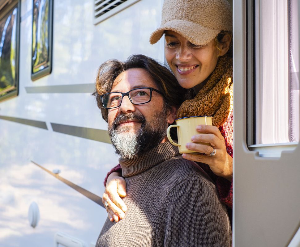 The Ultimate Guide To Off-Grid Water Filtration: Solutions For Remote Living A couple living off-grid enjoy their filtered water.