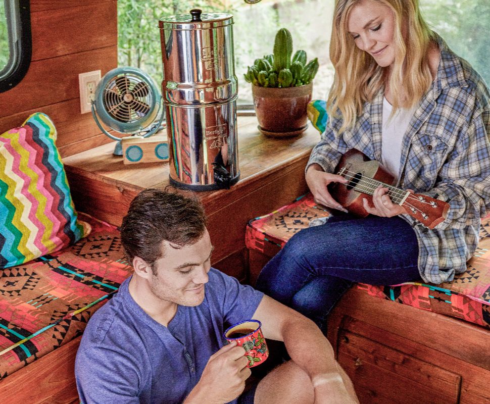 Vanlife, Tiny Homes & Filter Freedom: Why Travelers Love Berkey Two travelers enjoying their small home lifestyle with a Berkey Filter on the counter.